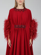 Load image into Gallery viewer, Close-up of embellishment on Dina Melwani red feather-trimmed draped kaftan dress