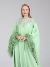 Load image into Gallery viewer, Close-up of embellishment on Dina Melwani green crystal-embellished feather-cuff kaftan
